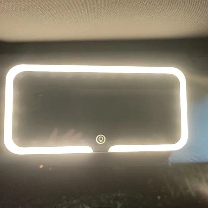 White ABS car sun visor mirror with LED lights and aluminium lens for make-up application.