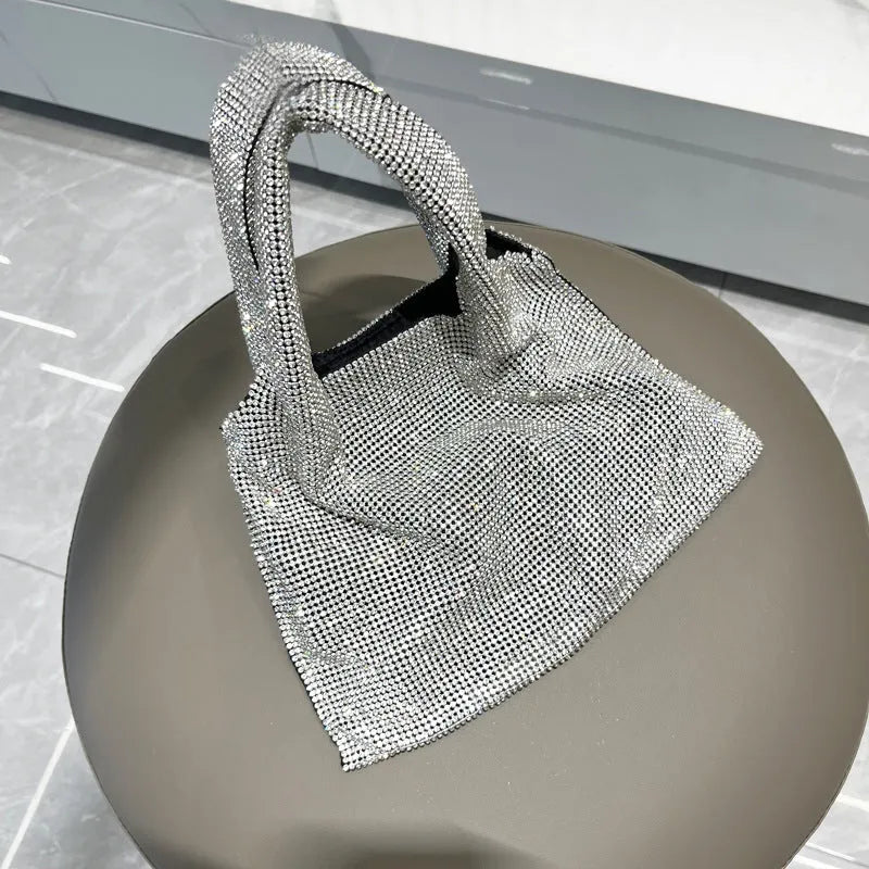 Silver evening handbag with shiny rhinestones and open pocket design made from cotton thread