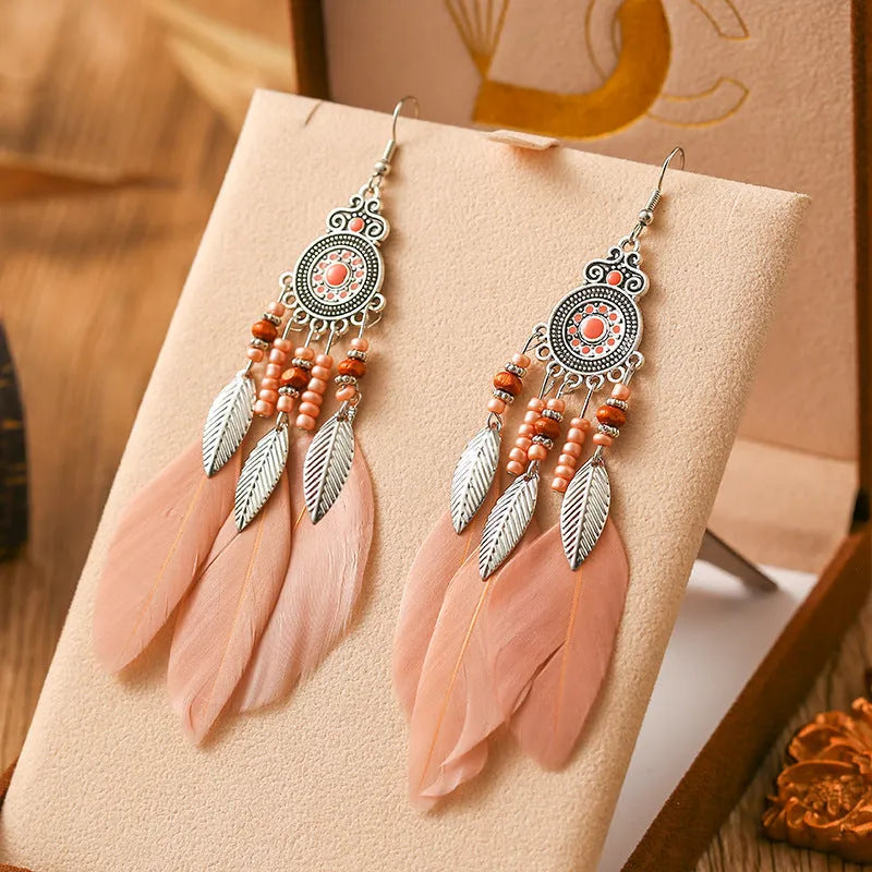 Bohemian style round drop feather earrings with leaf design in alloy, showing electroplated finish.