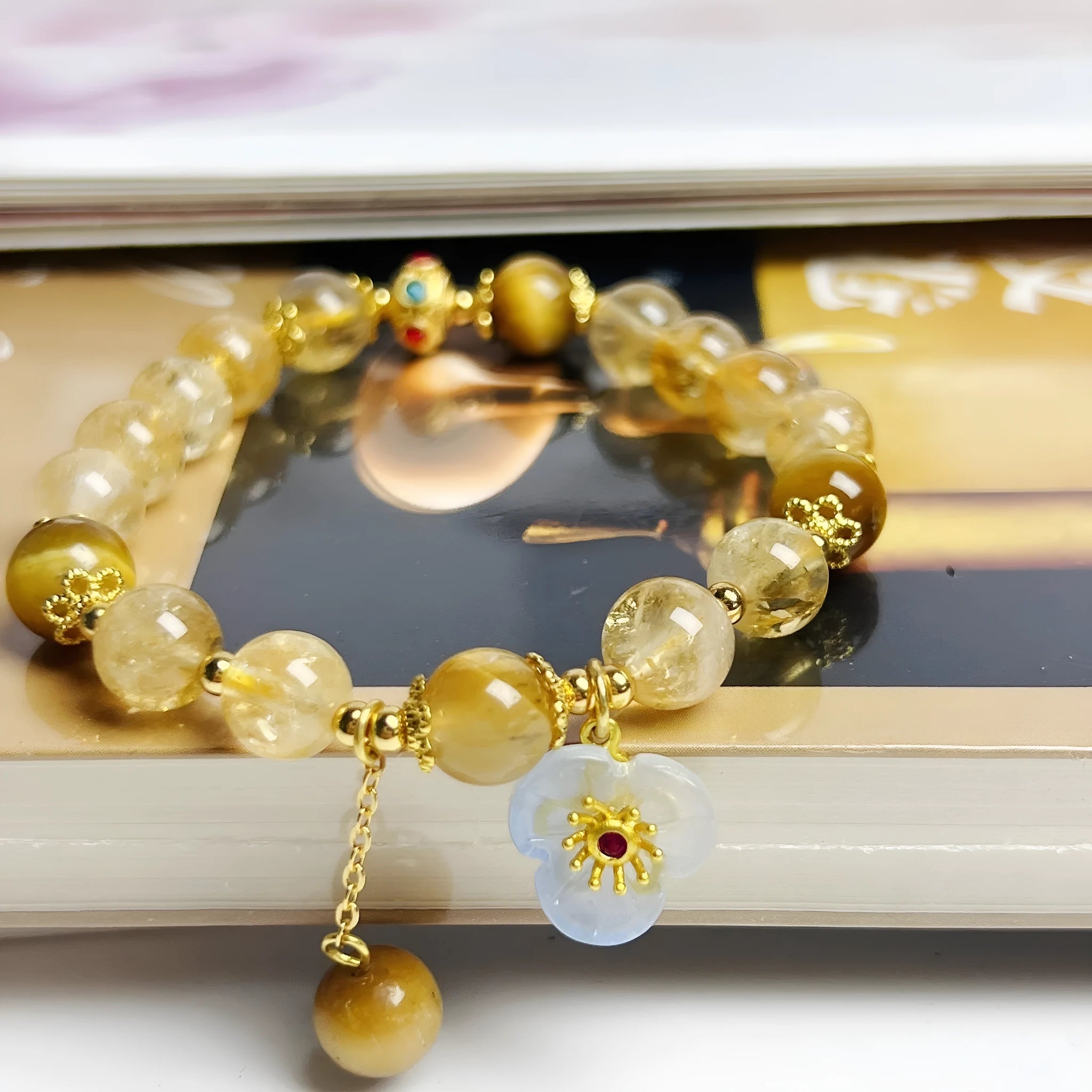 Women's citrine bracelet with floral tassel design, handcrafted crystal jewellery