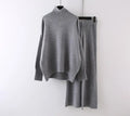 Women's milky white acrylic knit sweater and wide-leg trouser two-piece set on a hanger.