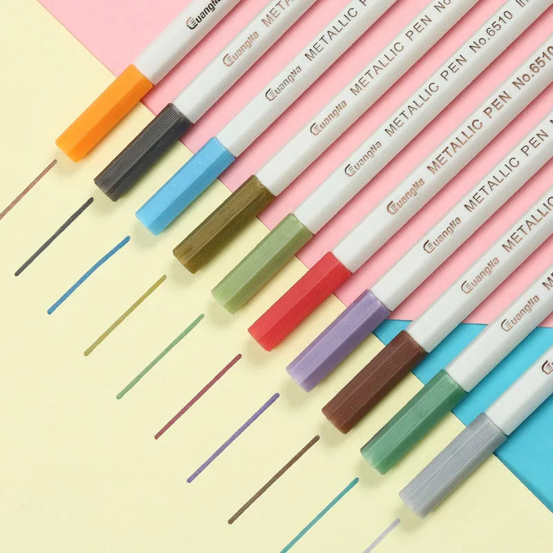 Card album metal pen set with plastic storage case containing multiple black barrel pens in various colours