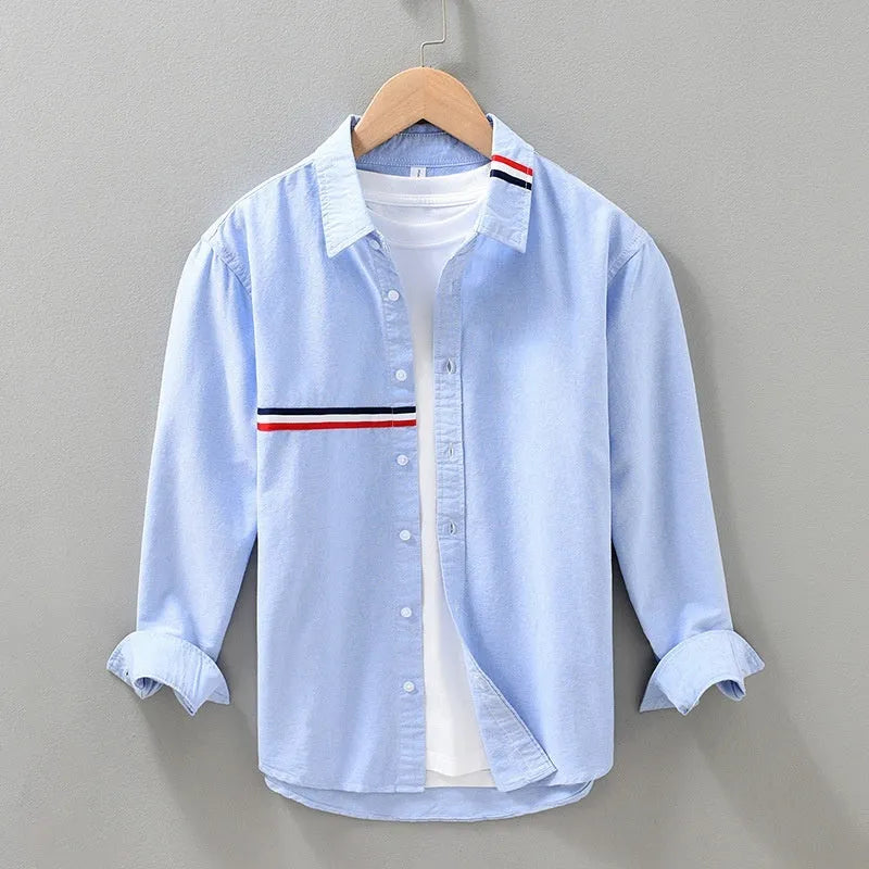 Hong Kong style loose fit cotton blend shirt in light blue, showing cardigan design on a hanger.