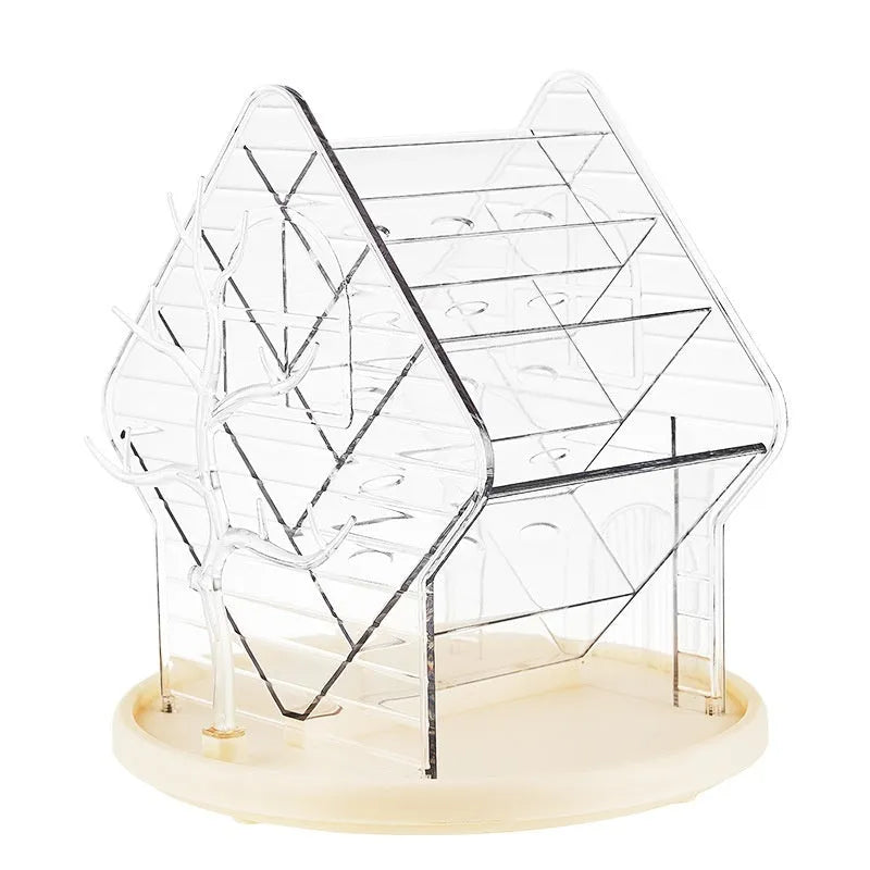 Clear and amber gold rotating plastic cosmetics storage box organiser on a table.