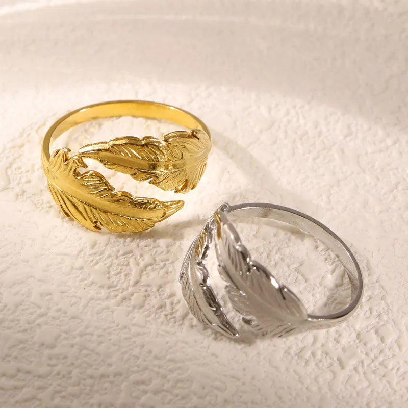 Women's stainless steel feather ring with adjustable opening in gold or silver finish