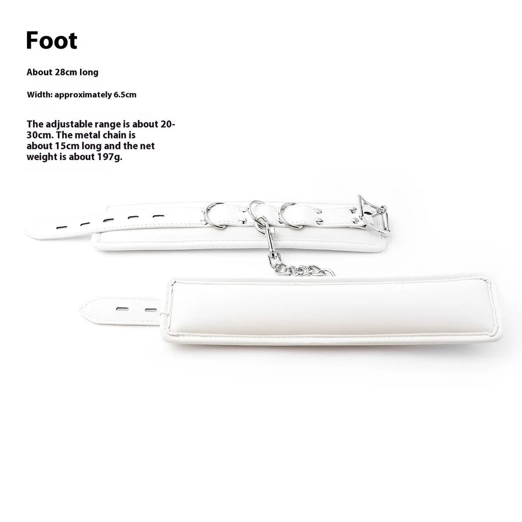 White PU sponge bondage handcuffs and foot cuffs with metal buckles on a nylon strap.
