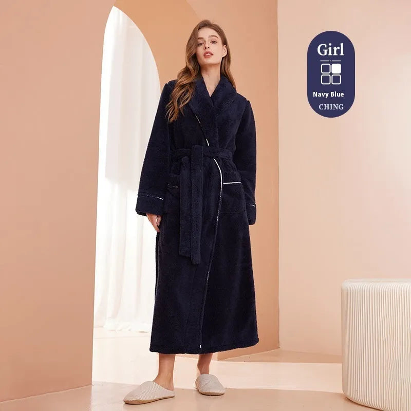 A man and woman wearing matching heavyweight navy blue flannel bathrobes, a couple's winter nightgown set.