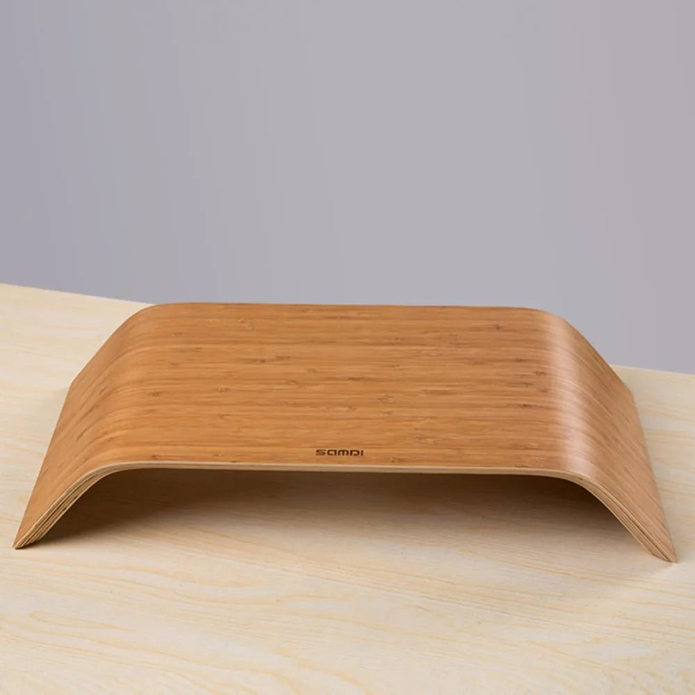 Walnut laptop stability bracket stand in bamboo leather colour on a desk