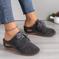 Women's lace-up wedge slippers in suede with a rubber sole, shown in a light grey colour.