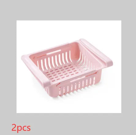 Blue telescopic plastic storage basket for refrigerator organisation with fruits and vegetables inside.