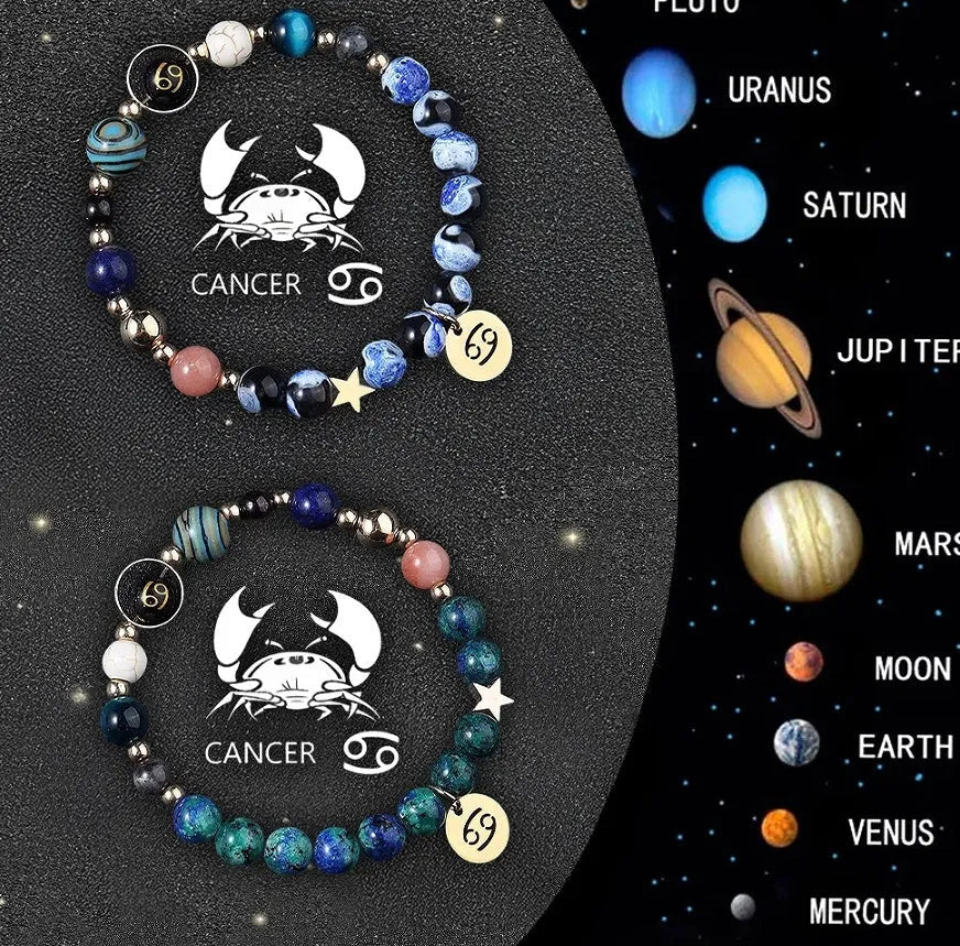 Two natural stone beaded bracelets with sterling silver zodiac charms on a wooden surface.