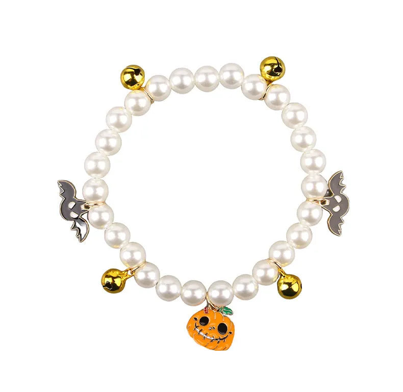 Halloween cat collar decorated with simulated pearls in a pumpkin design on a pet