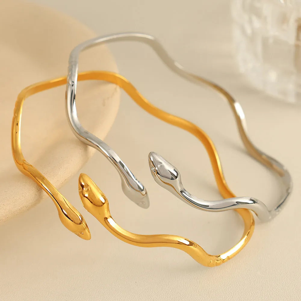 Niche Minimalist Open-end Gold Ripple Line Bracelet on wrist showing ripple texture and electroplated finish.