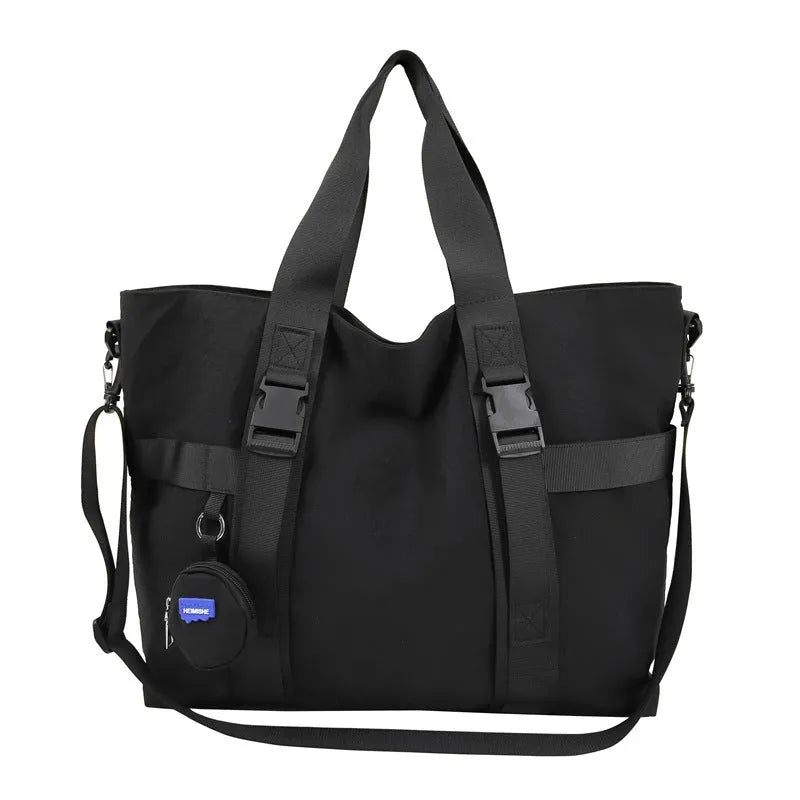 Men's grey Oxford cloth travel shoulder bag showing large main compartment and separate coin purse.