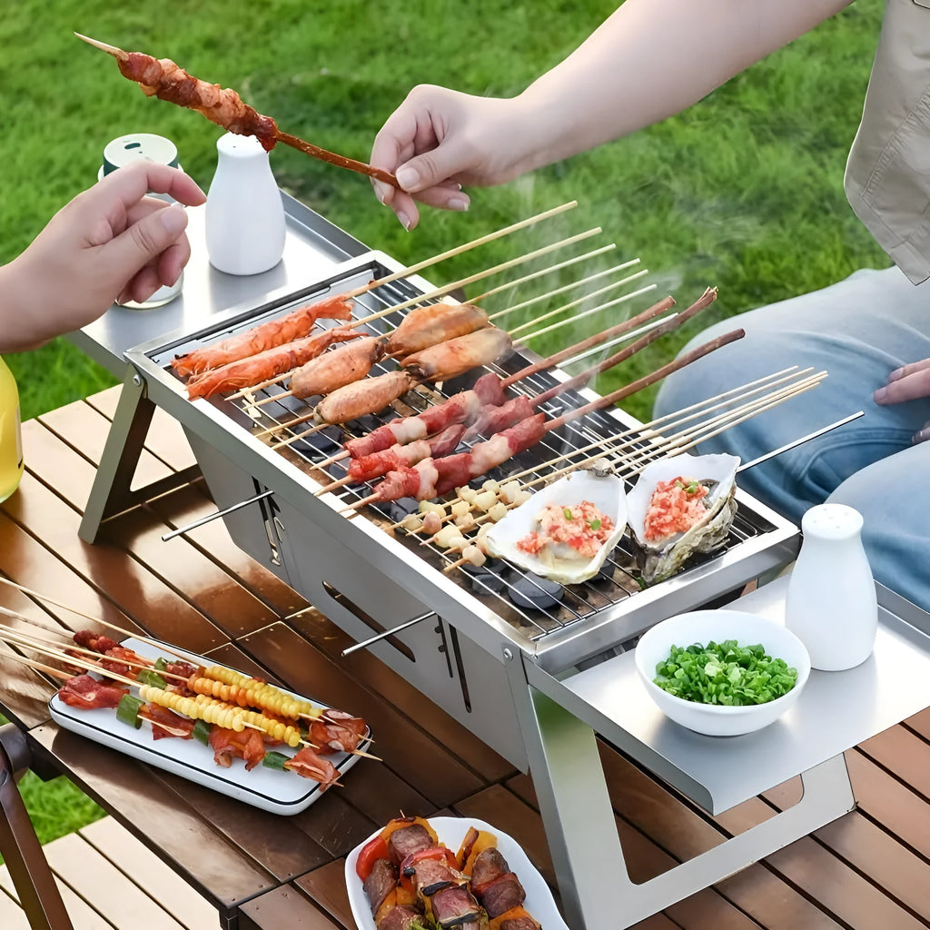 Small collapsible charcoal barbecue grill with folded legs, shown flat-packed.