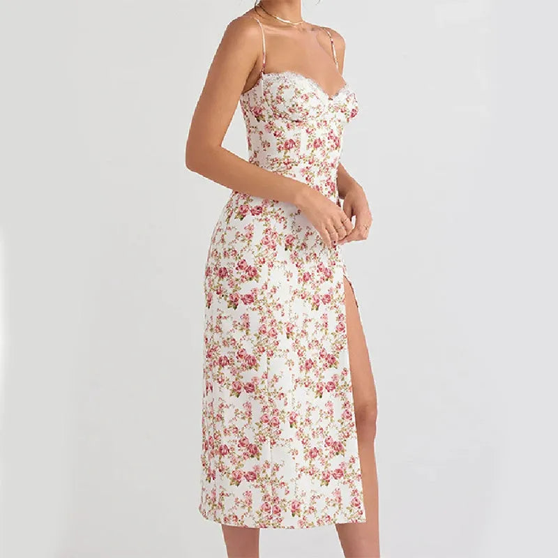 Blue long dress with white lace flower print, featuring a thigh slit and thin suspender straps.