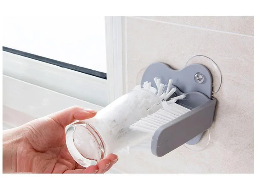 Grey double-head rotating cup brush with suction cups for wall mounting