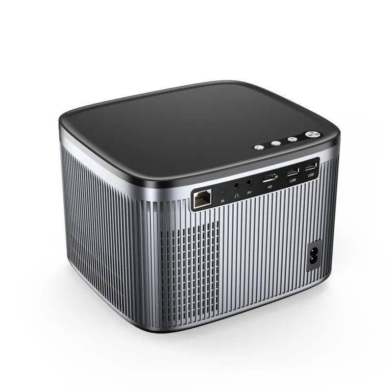 Silver portable 1080P home projector projecting a 100-inch image in a dark bedroom