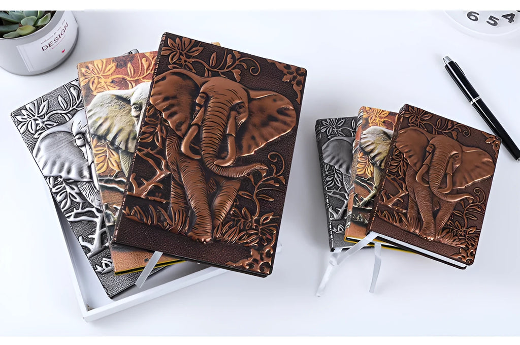 Hardcover PU leather notebook with embossed retro cover and brushed bronze details, open at 180 degrees showing beige pages