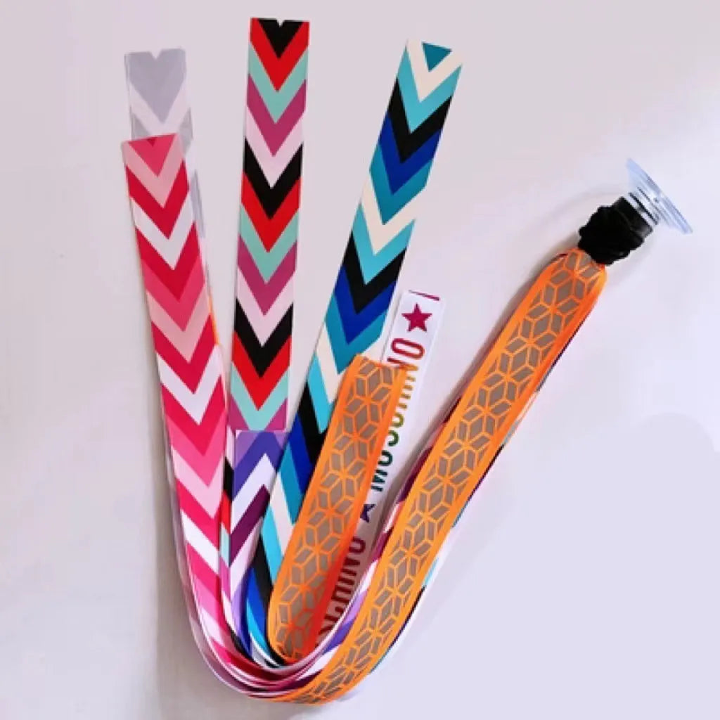 A decorative ribbon streamer for attaching to a child's roller skate or ski helmet, shown in a selection of colours.