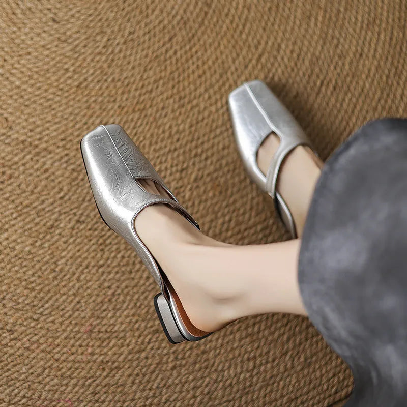 British style square toe outdoor slippers in beige with a low heel and rubber sole.