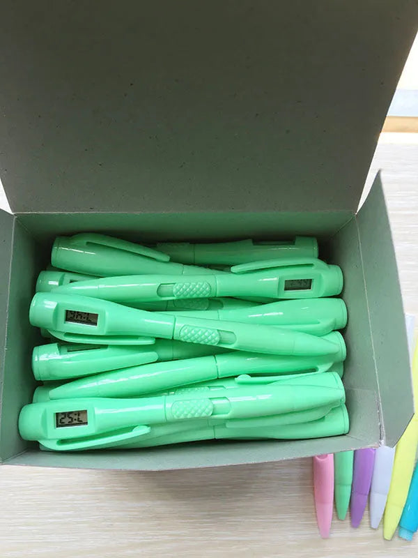 Electronic watch test ballpoint pen with plastic shell in a colour option, on a plain background