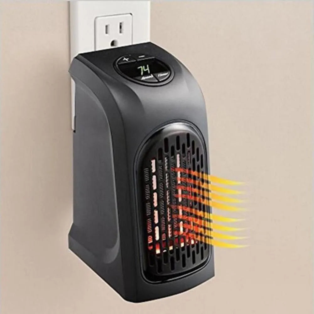 Small black ceramic fan heater with control buttons on top, showing plug and compact size.