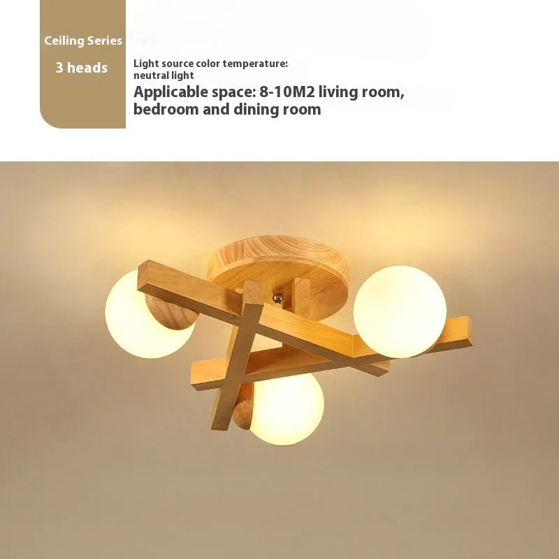 Modern three-headed pendant ceiling light with neutral bulbs in a Nordic style, suitable for a wooden living room.