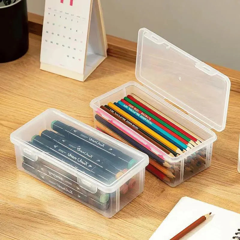 Large transparent pencil storage box with compartments for organising coloured pencils and drawing materials