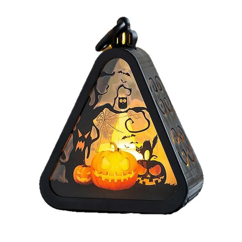 A plastic pumpkin-shaped Halloween lamp decoration with a flickering LED light, shown in one of four colour themes.