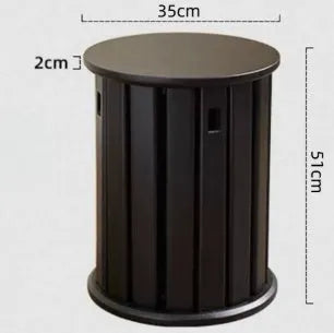 Stackable round iron dining stool in smoked black, walnut, cherrywood, or cream colour on a tiled floor.