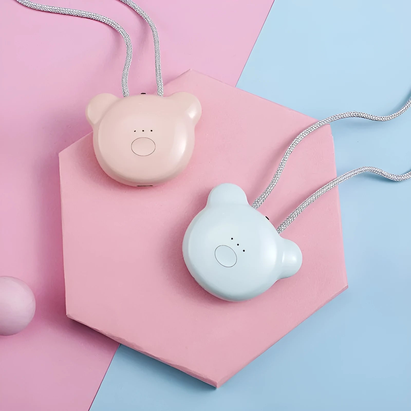 Mini USB portable air purifier necklace in pink, showing compact size and wearable design.