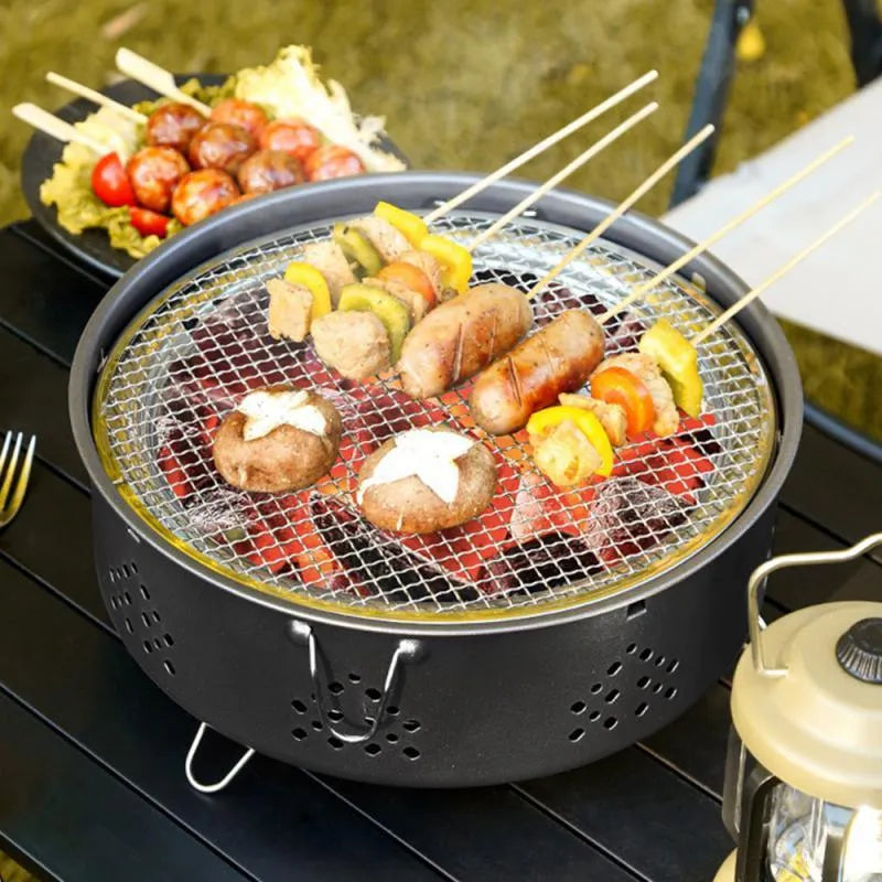 Portable stainless steel detachable BBQ grill with carry bag for outdoor camping.