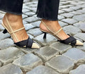 Apricot and black colour block women's stiletto sandals with a pointed toe and ankle buckle.