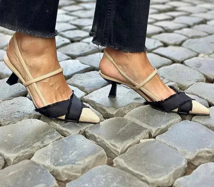 Apricot and black colour block women's stiletto sandals with a pointed toe and ankle buckle.