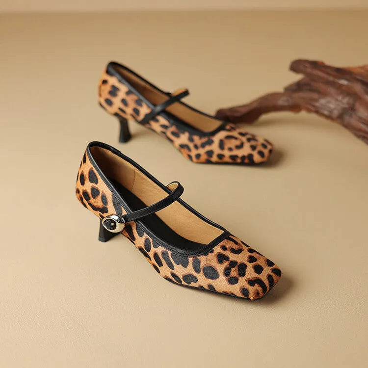 Black women's square toe stiletto ankle-strap heels with horse hair upper and buckle closure.