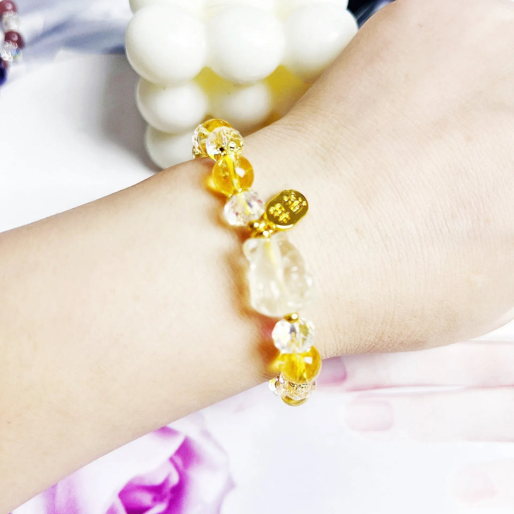 Women's crystal bracelet with a detailed nine-tail fox charm in natural citrine.
