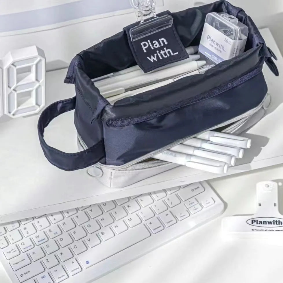 Fashion student pencil case in beige, blue, and navy blue, showing double layer open design.