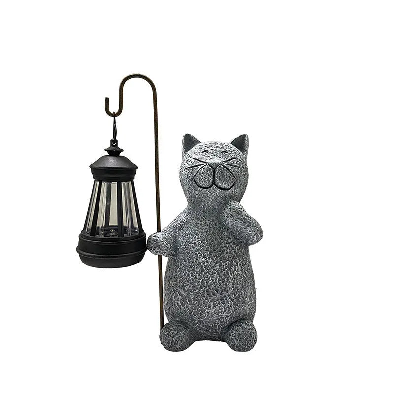 Solar-powered garden lamp with resin kitten ornament decoration for outdoor lighting