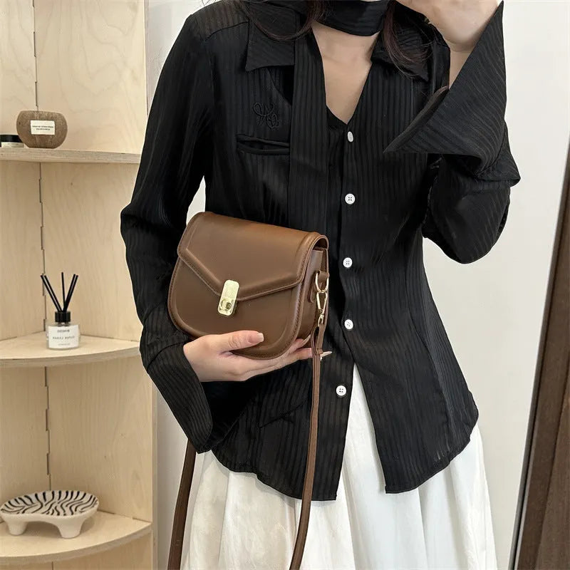 Soft PU clamshell messenger bag in horizontal square shape on a shoulder strap.