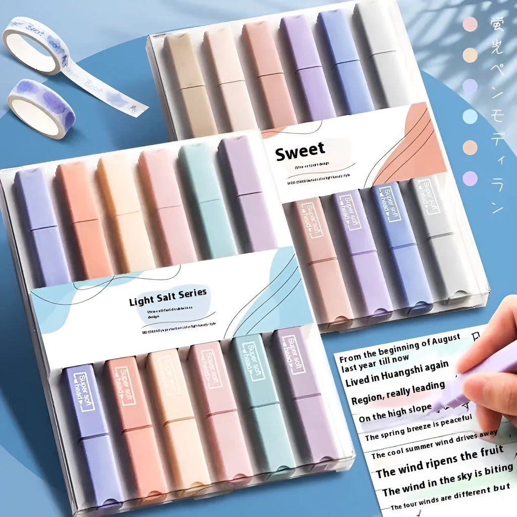 Set of double-headed fluorescent marking pens in bright colours on a white background.