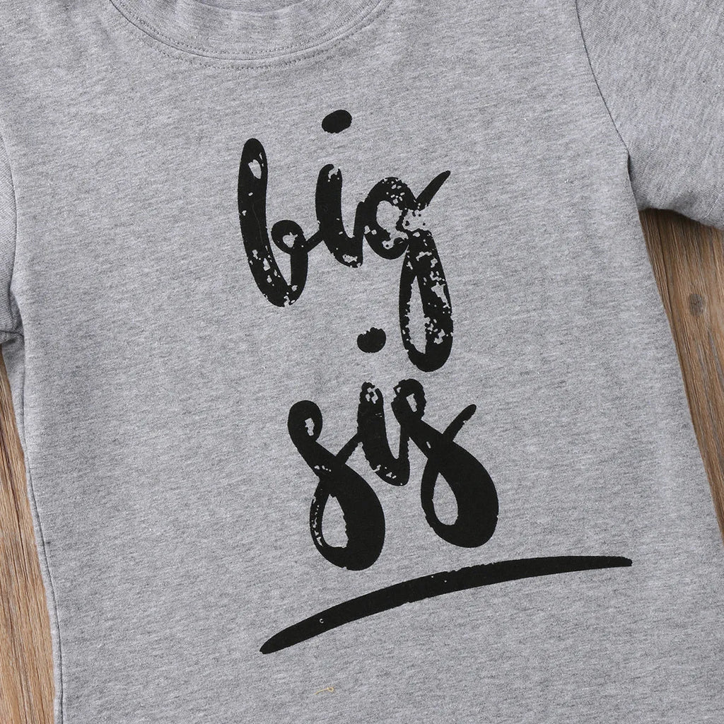Grey cotton t-shirt for a child with a print, shown in sibling-themed colour variations.