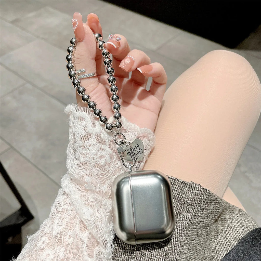 Matte plating colour TPU protective case for AirPods with an attached carrying bracelet.