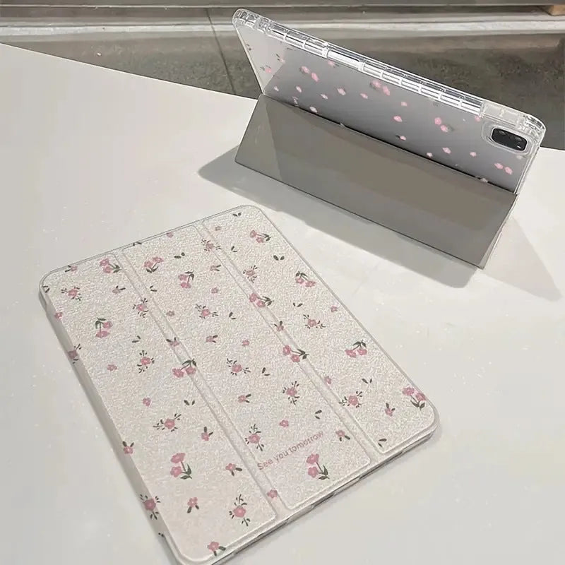 Transparent floral patterned iPad case folded into standing position showing magnetic closure and port cutouts