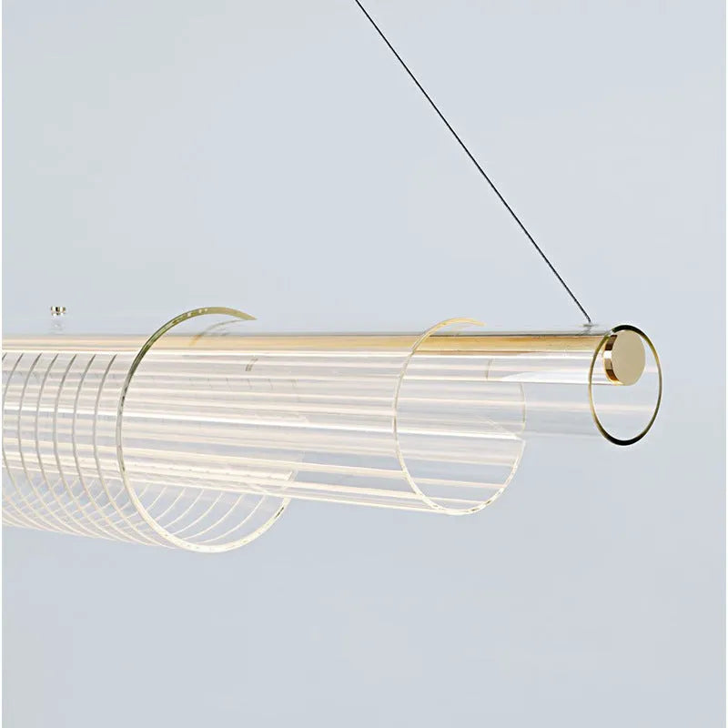 Modern minimalist glass pendant lamp with iron fittings in three length options.