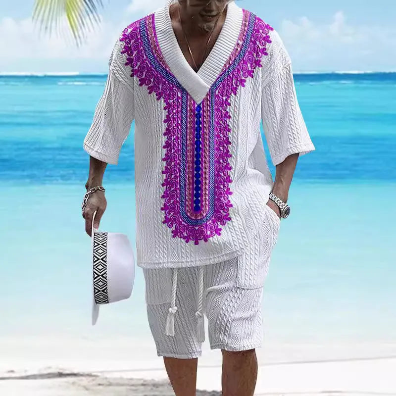 Man wearing a printed drop-shoulder knitted short-sleeve top with matching shorts.