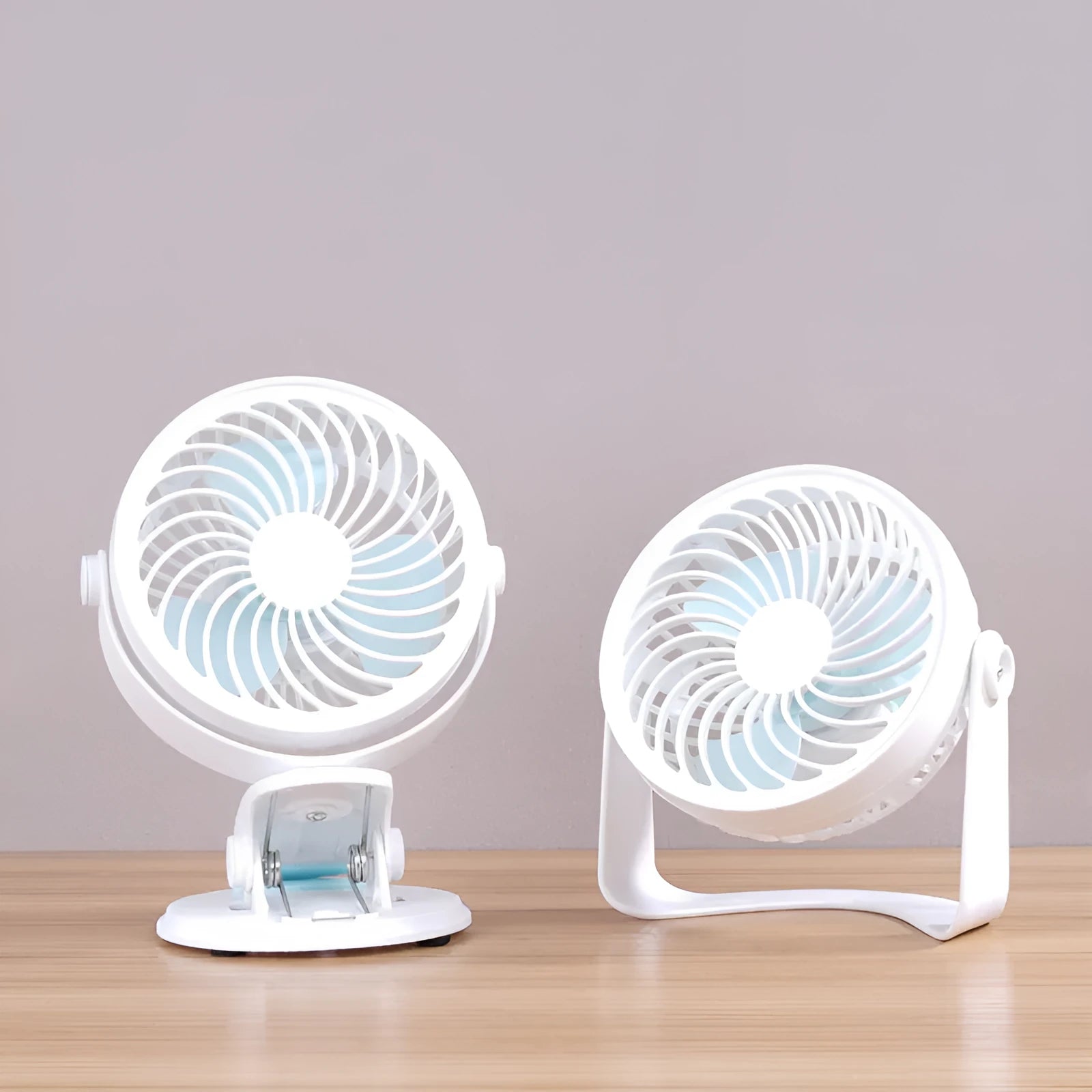 Small white USB desk fan shown in clip-on and floor-standing styles on a wooden desk
