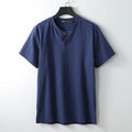 Loose fit apricot-coloured V-neck short sleeve women's top on a hanger