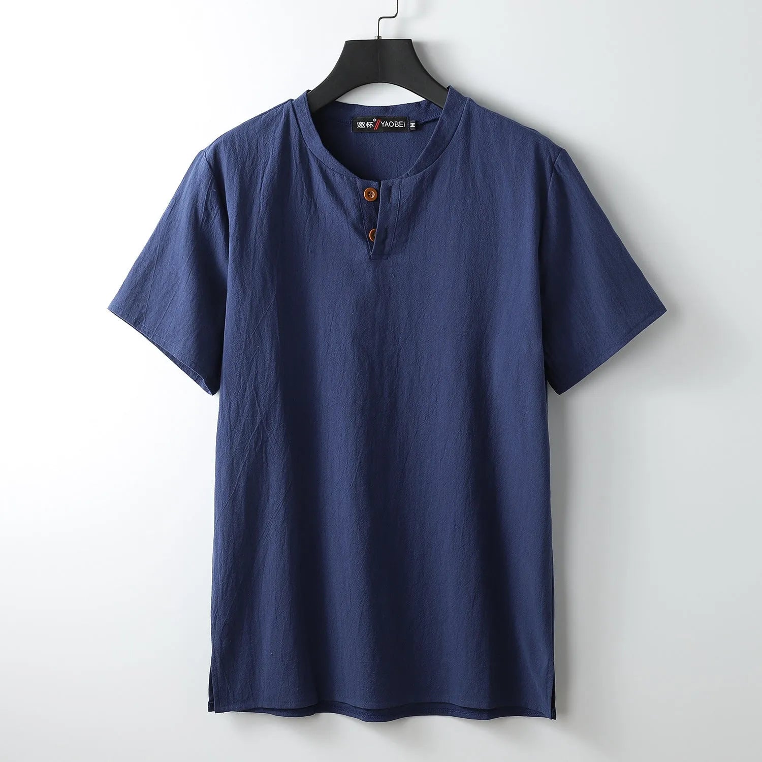 Loose fit apricot-coloured V-neck short sleeve women's top on a hanger