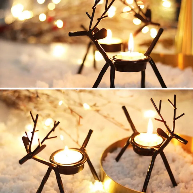 Black iron Christmas candlestick with deer and elk bracket design on a table.